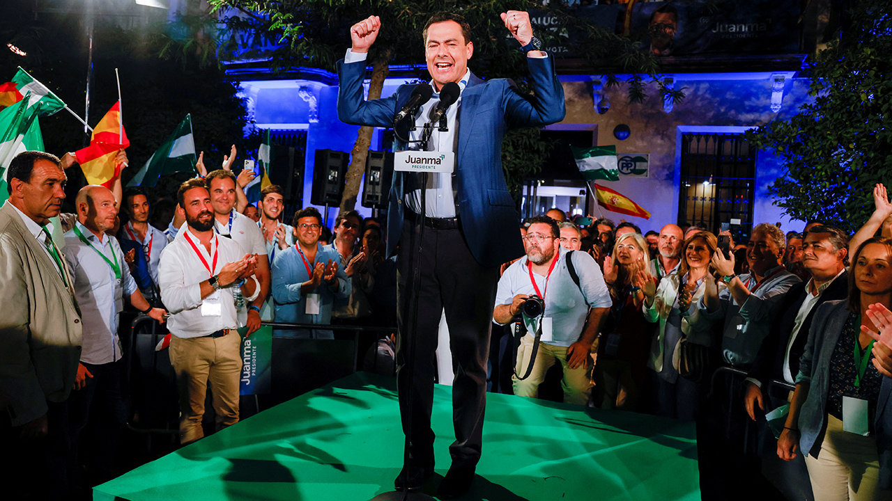 Andalusian Regional President and People's Party (PP) candidate Juan Manuel Moreno Bonilla reacts in front of supporters as he celebrates the result in Andalusian regional elections at the People's Party (PP) headquarters in Seville, Spain June 19, 2022. REUTERS/Marcelo del Pozo