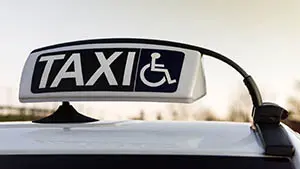 Public car equipped for assistance and transportation for handicapped person