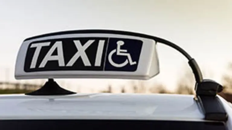 Public car equipped for assistance and transportation for handicapped person