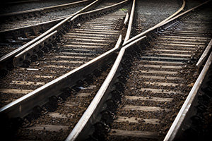 train line crossing at night, with selective focus & vignetting.